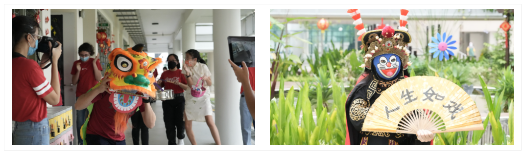 A performer wearing a colourful lion dance costume entertains TKGS staff during a Chinese New Year celebration.